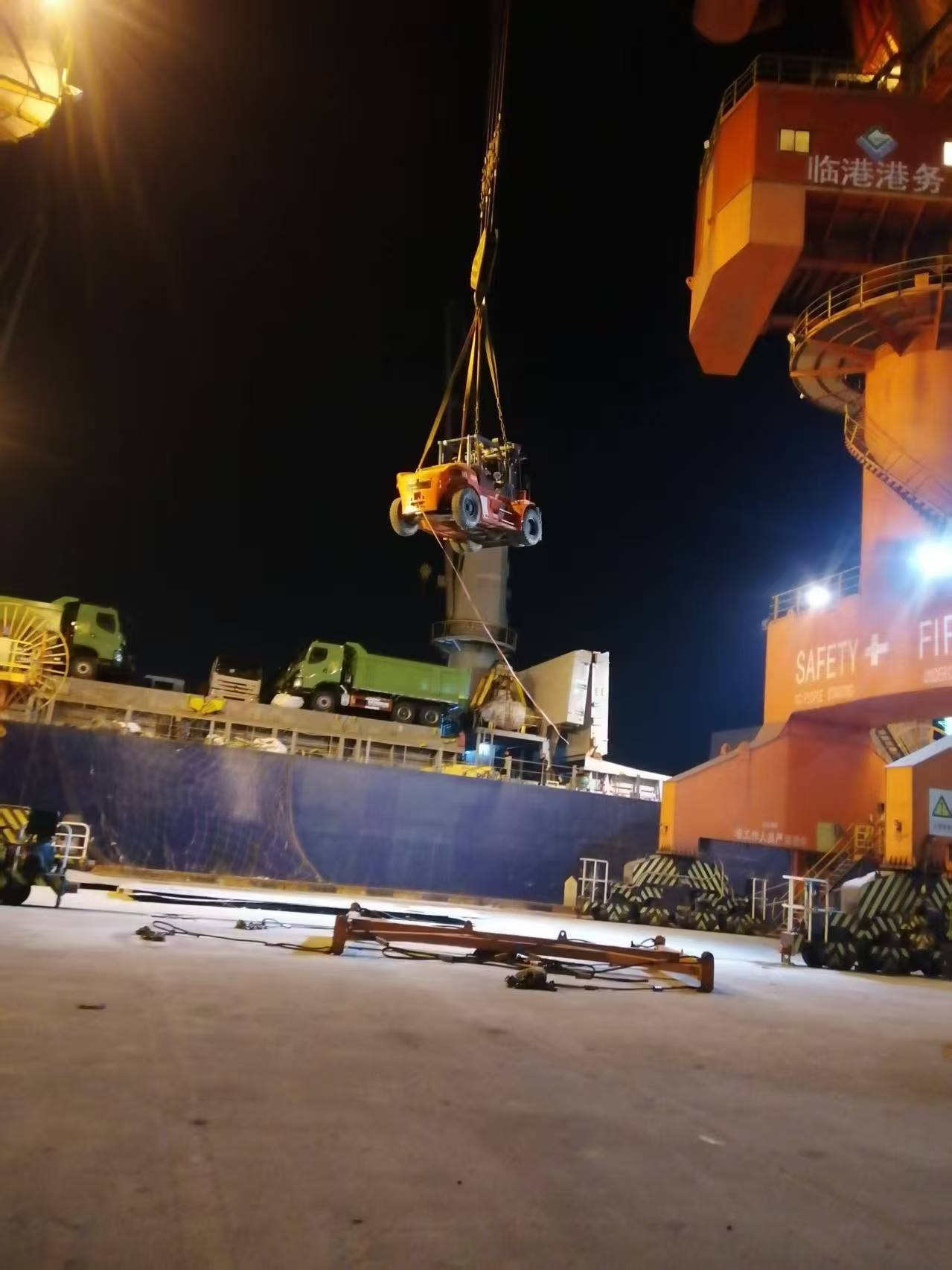 Excavator Being Loaded and Shipped from Port