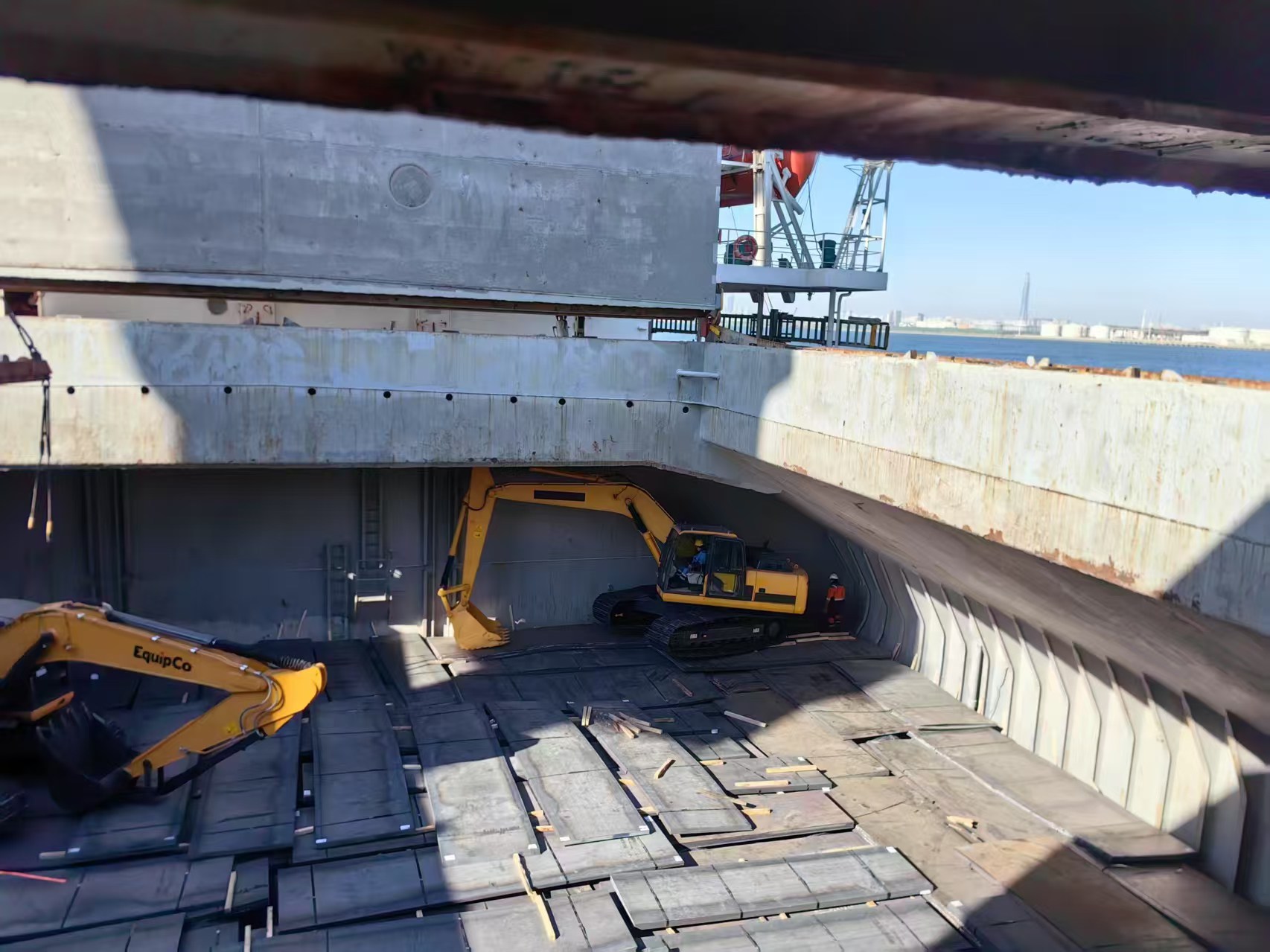 Excavator Being Loaded and Shipped from Port
